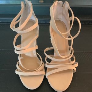 Beige strappy high heals never worn